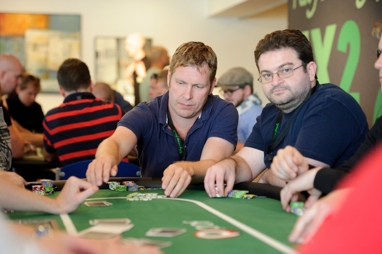 Men playing a game of poker at a poker table