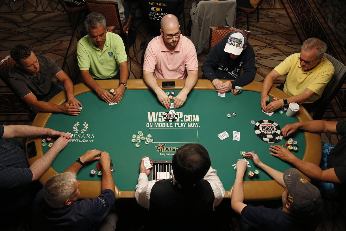 Large group of people playing poker
